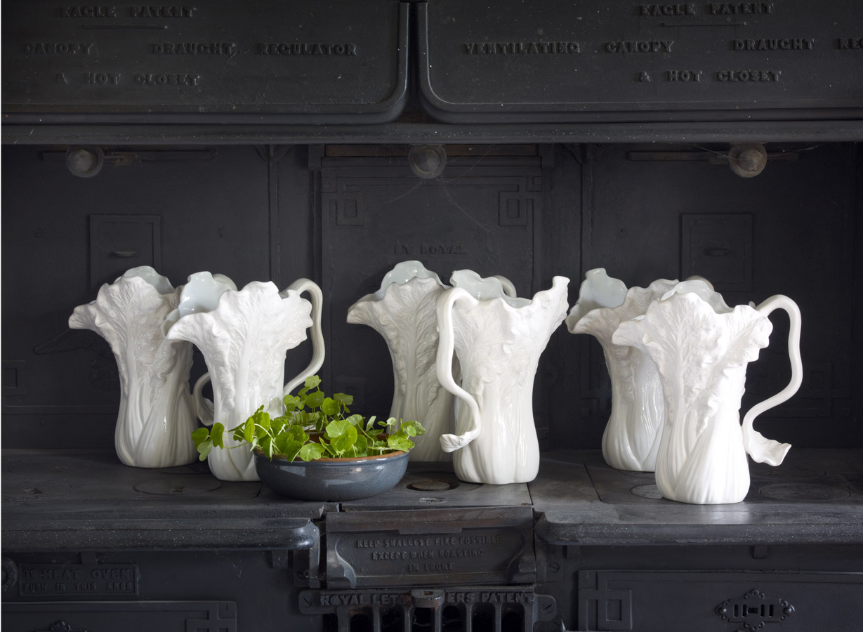 White Pitchers on Dark Gray Hutch